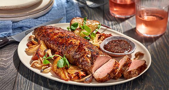 Seasoned and juicy pork tenderloin served with sides