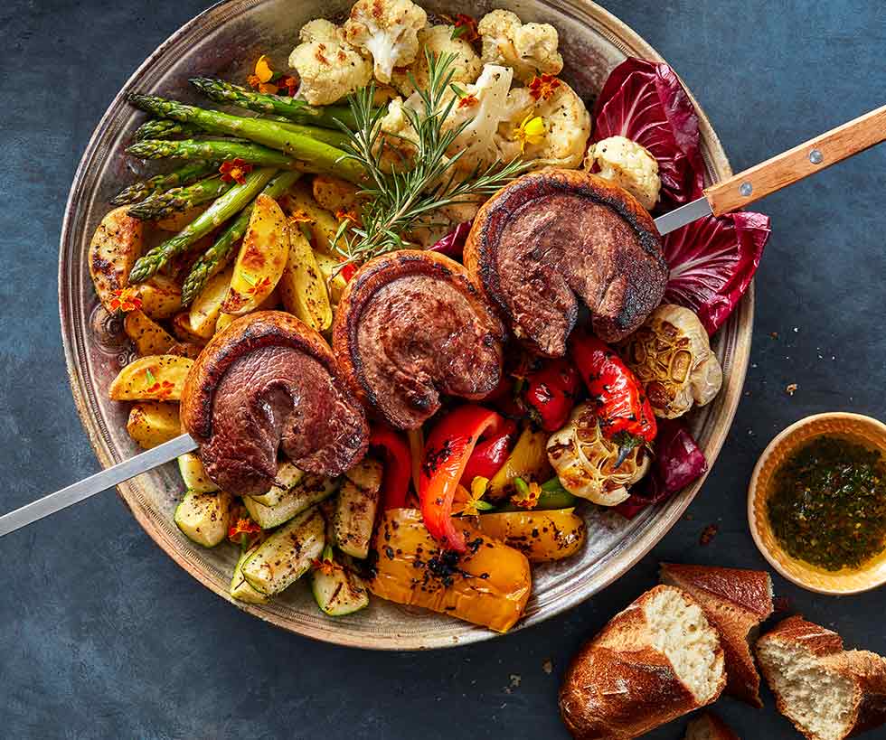 Picanha beef on a skewer with cauliflower, mushrooms, asparagus and other vegetables